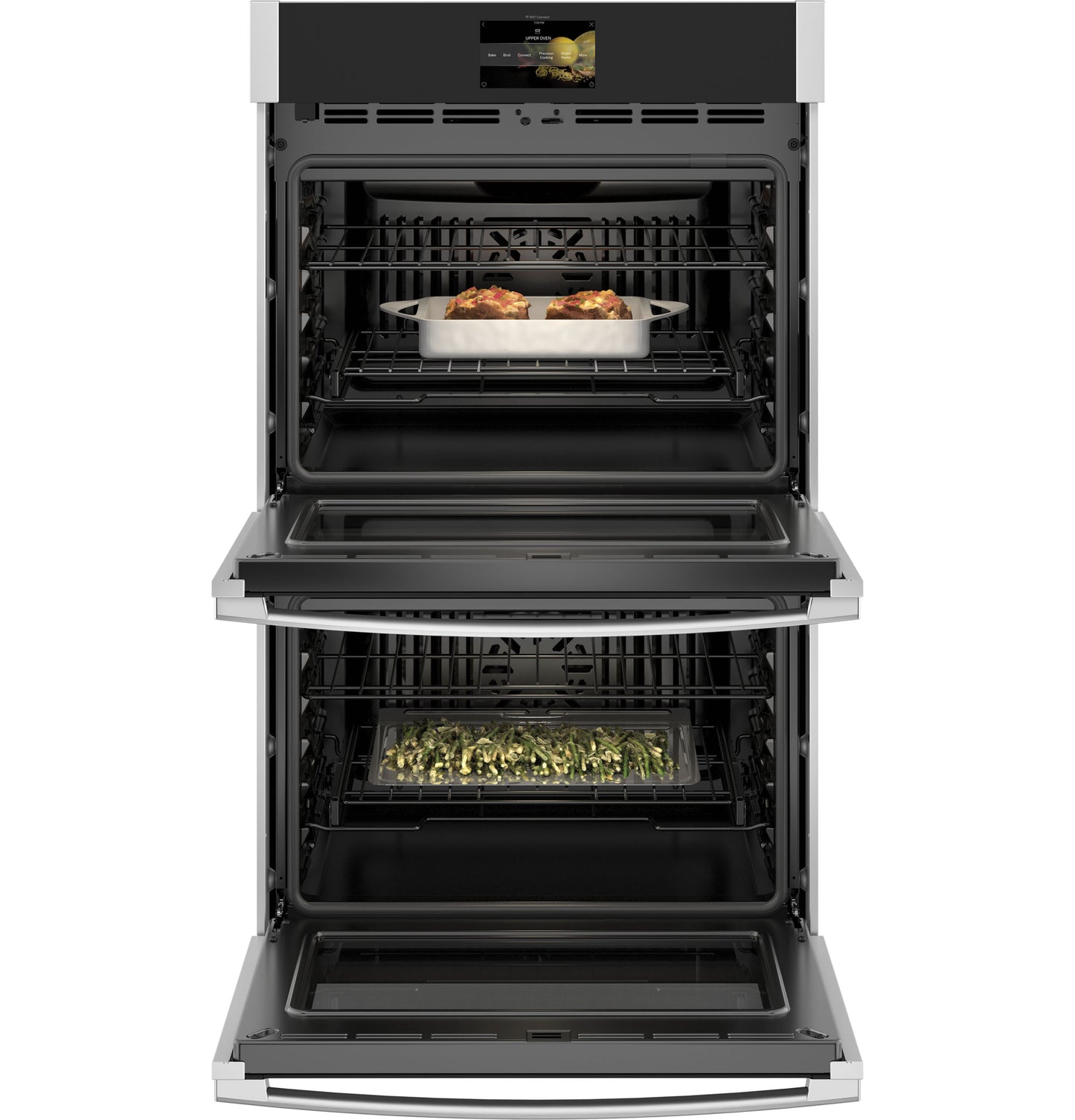 Open double wall oven with stainless steel trim cooking casseroles and vegetables in Kitchen & Kitchenware collection