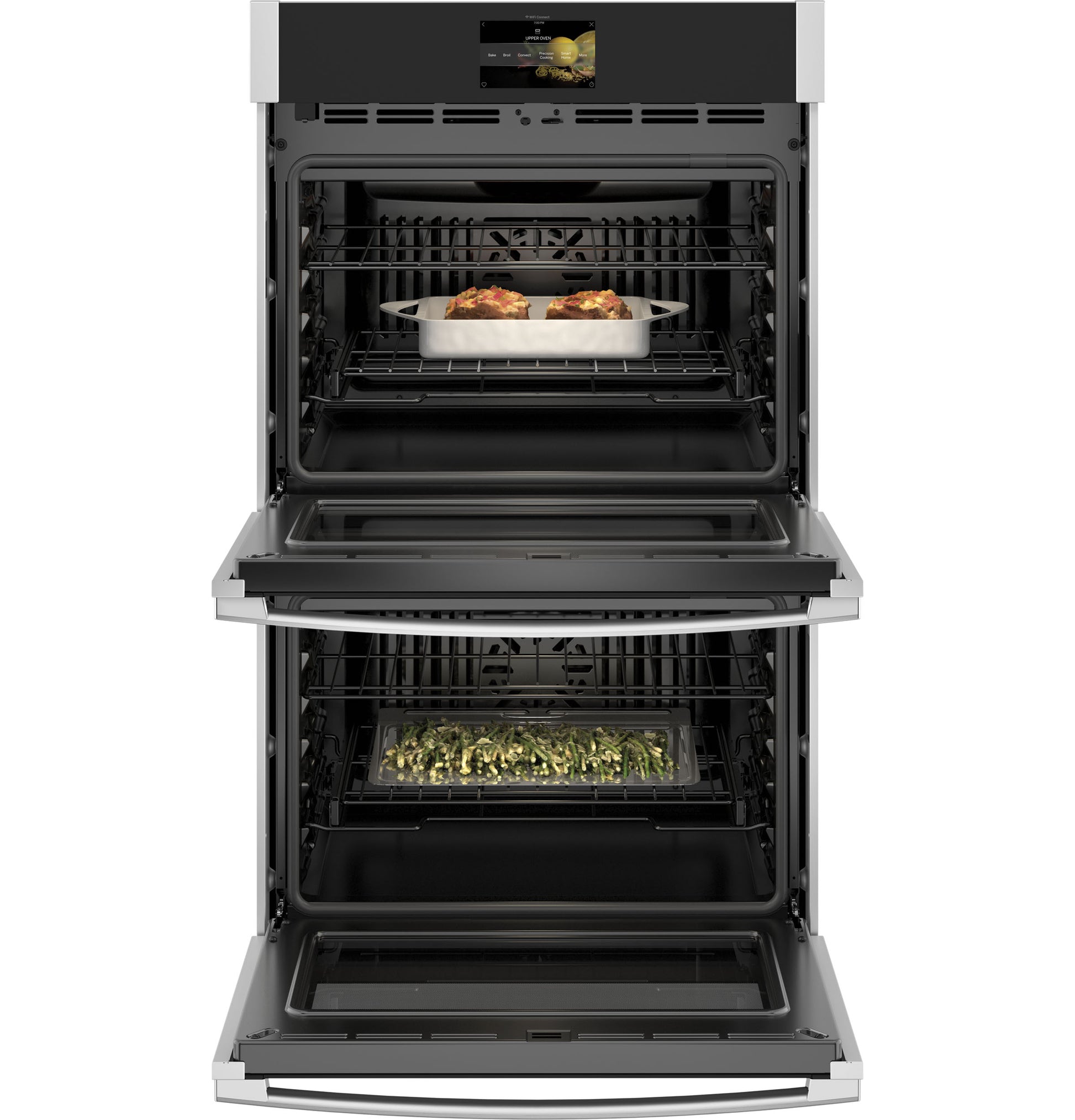Open double wall oven with stainless steel trim cooking casseroles and vegetables in Kitchen & Kitchenware collection