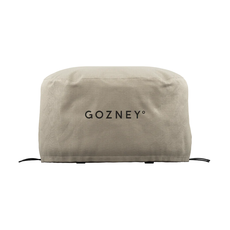 Weather-resistant grill cover in neutral taupe with black logo for outdoor living and grill accessories collections