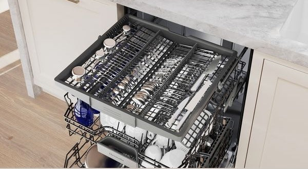 Open stainless steel dishwasher showing organized racks with clean dishes inside from kitchen appliances collection