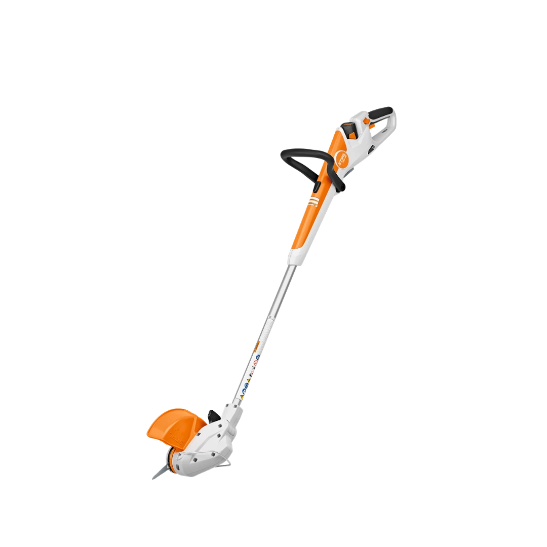 White and orange cordless battery-powered trimmer with ergonomic handle for tools and home improvement use