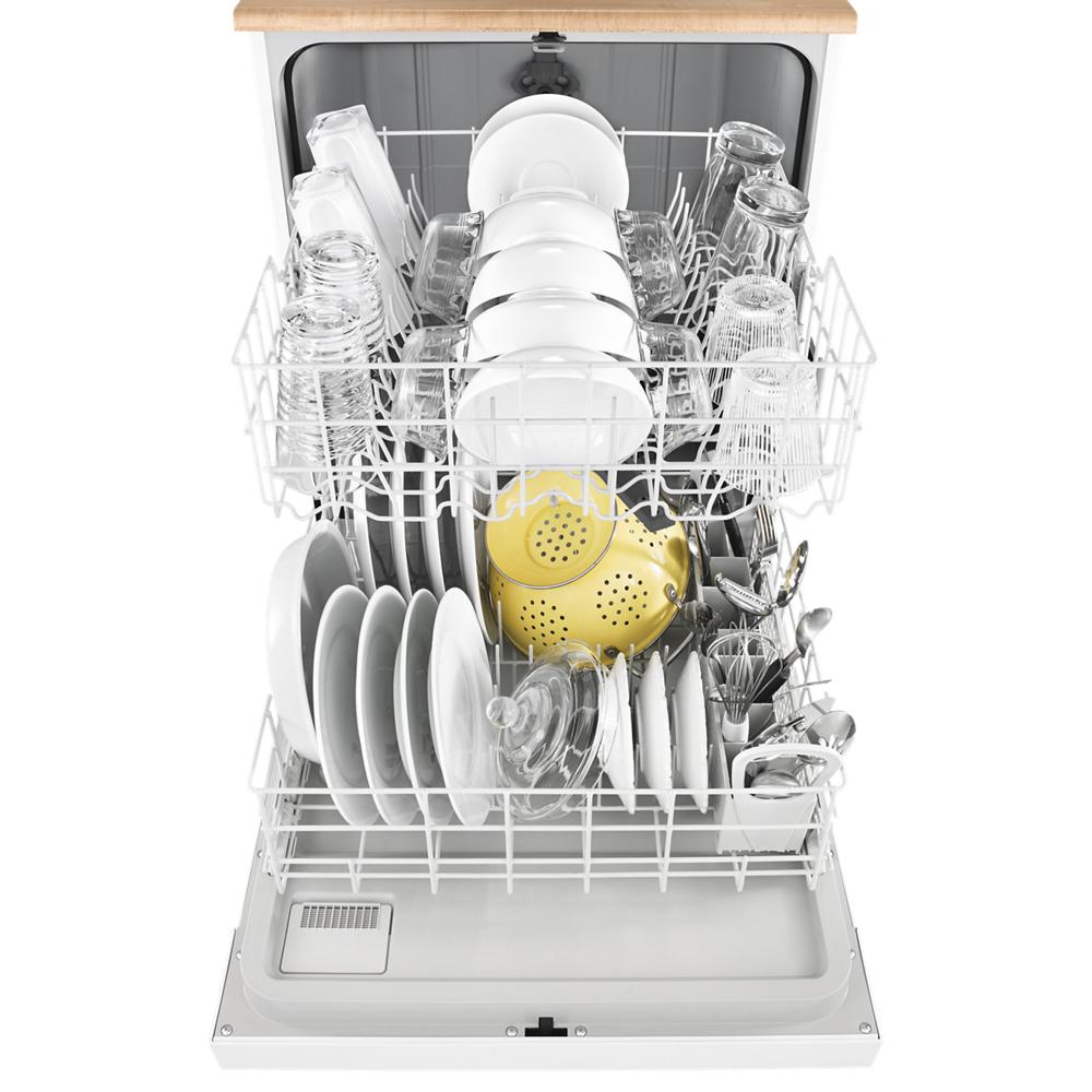 Open dishwasher fully loaded with white dishes, glassware, and yellow strainer in kitchen appliances for home improvement