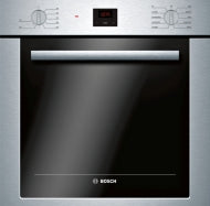 Stainless steel single wall oven with black glass door and digital display in modern kitchen appliances collection