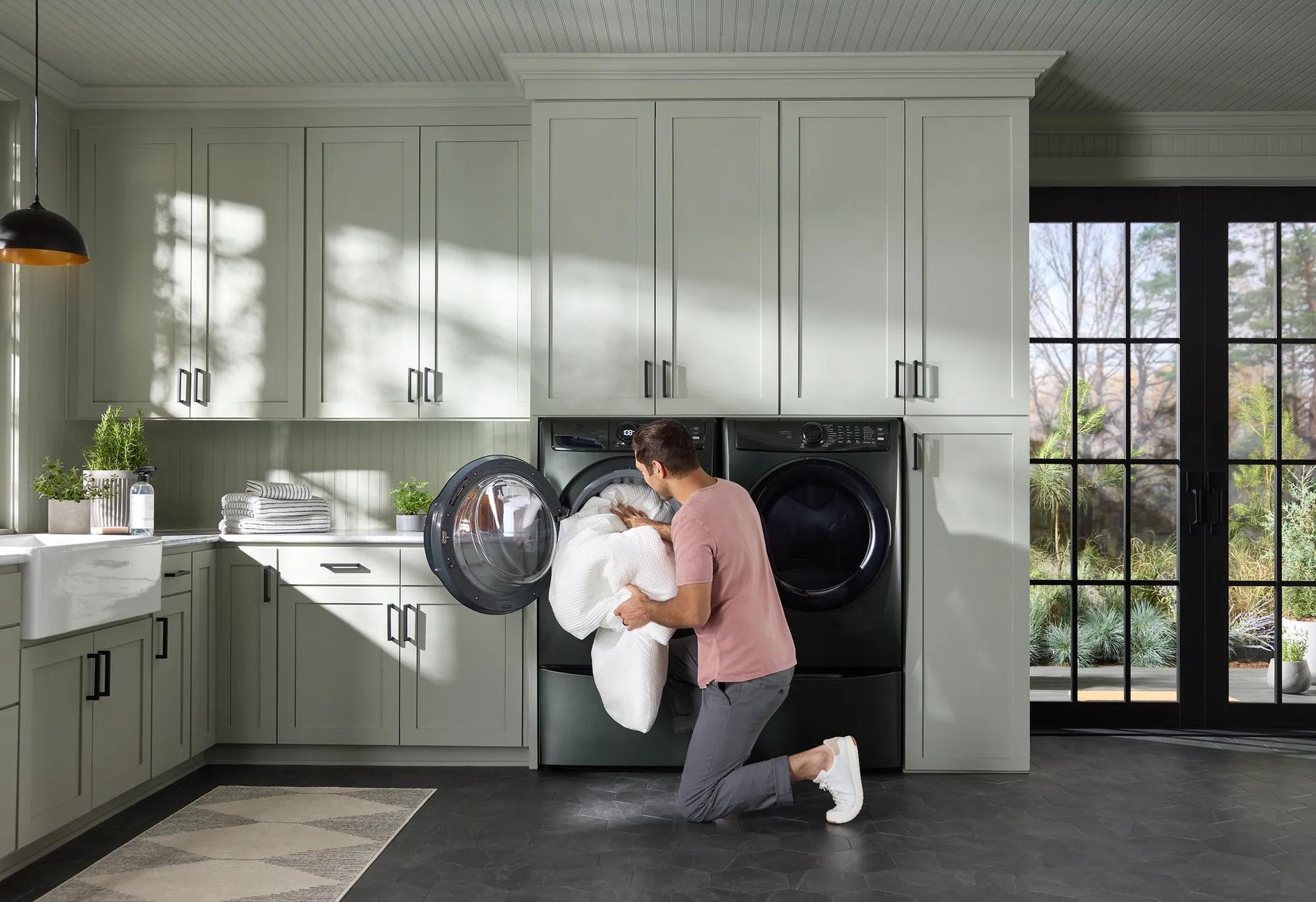Matte dark gray front load electric dryer with open door in modern laundry room in Dryers and Appliances collections