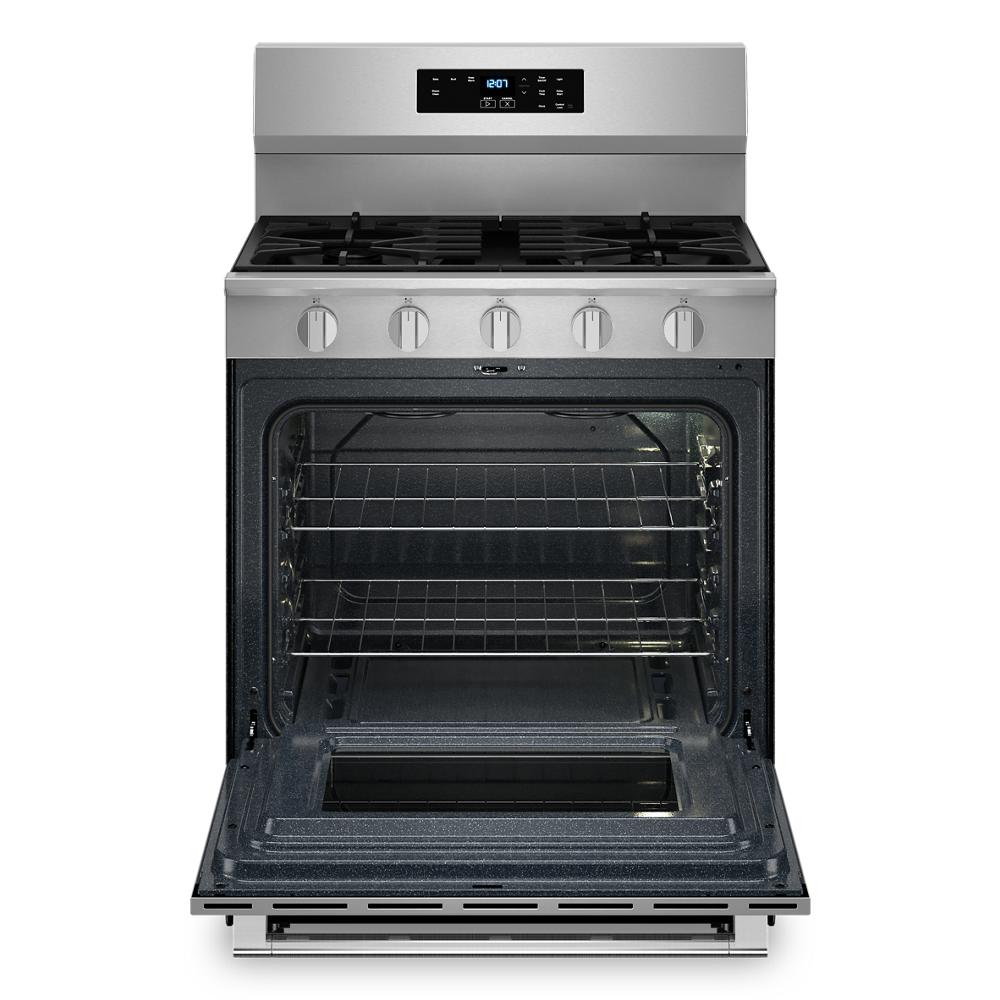 Front view of a stainless steel gas range oven with open door and multiple racks from kitchen appliances collection