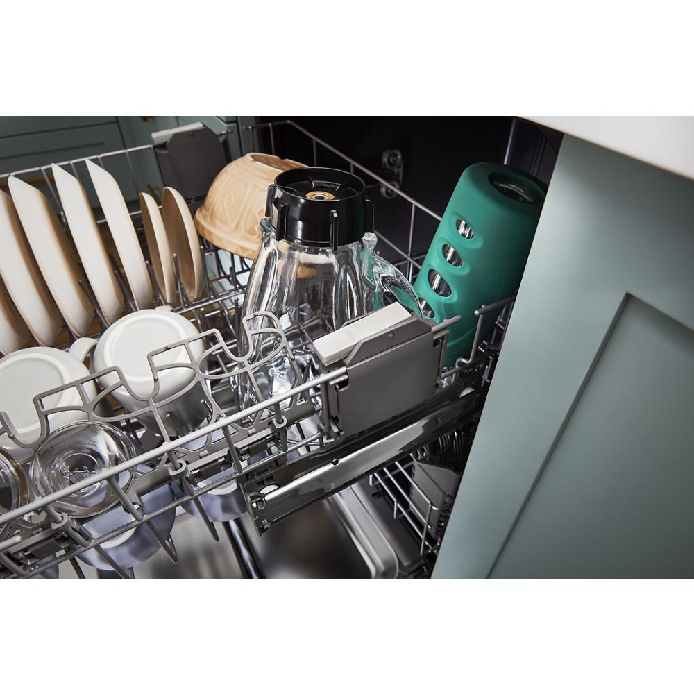 Open dishwasher with adjustable upper rack loaded with glassware, dishes, and kitchenware in kitchen appliance collection