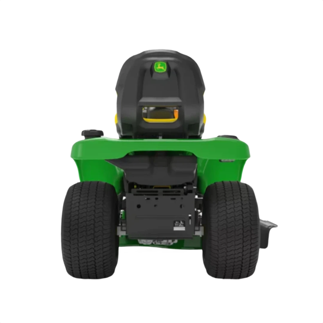 Rear view of green riding lawn mower with wide tires for outdoor power equipment and lawn care tools