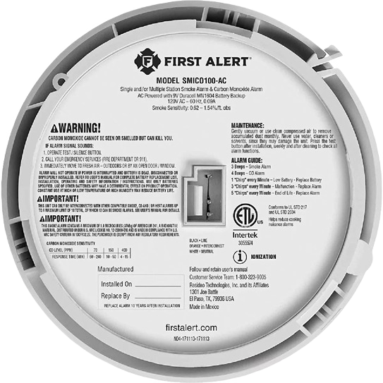 Back view of a white hardwired ionization smoke and carbon monoxide alarm with warning and maintenance instructions