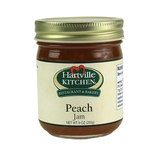 Glass jar of Hartville Kitchen peach jam with gold lid for jams and jellies in food and beverage collections under $25