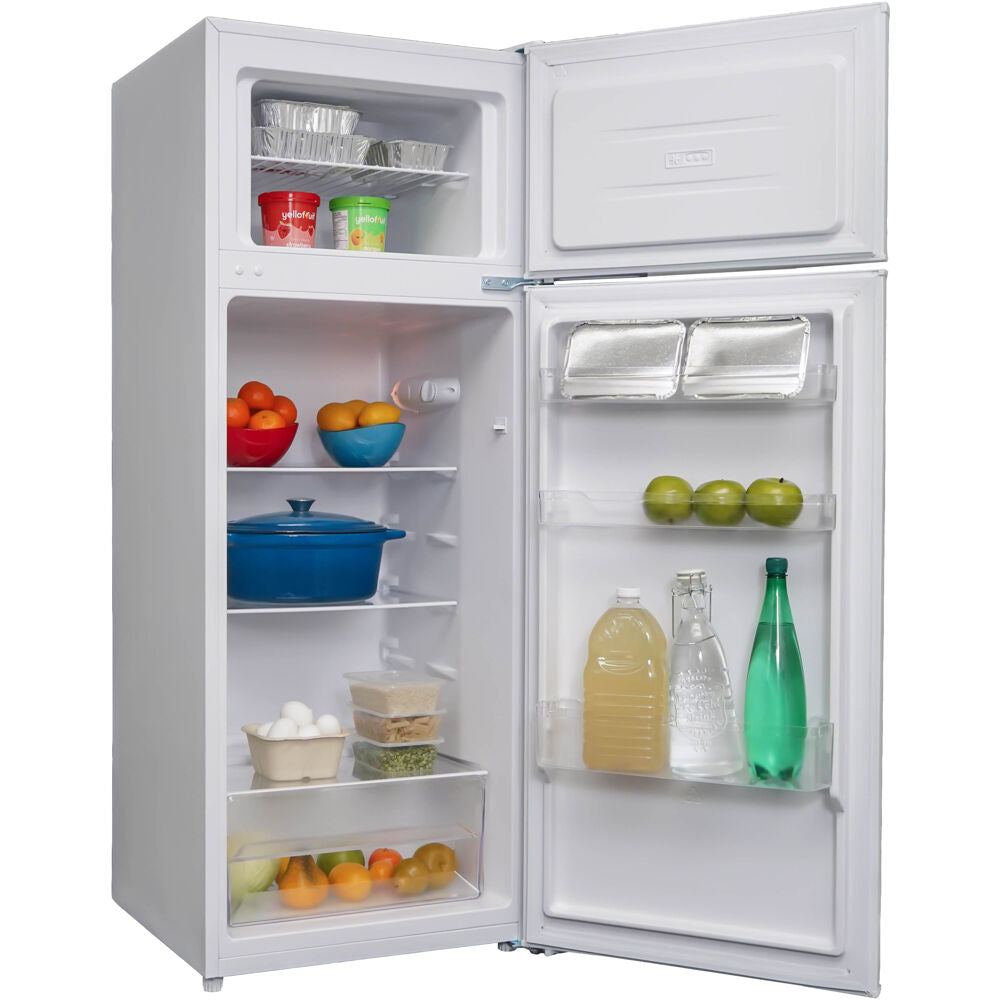 White top freezer refrigerator with manual defrost and covered crisper, stocked with food and beverages in appliance setting