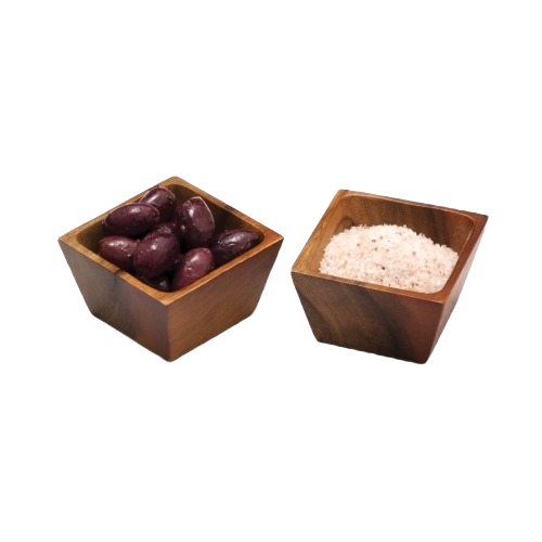 Two acacia wood square bowls, one holding olives and the other filled with coarse salt, for kitchen and tableware use