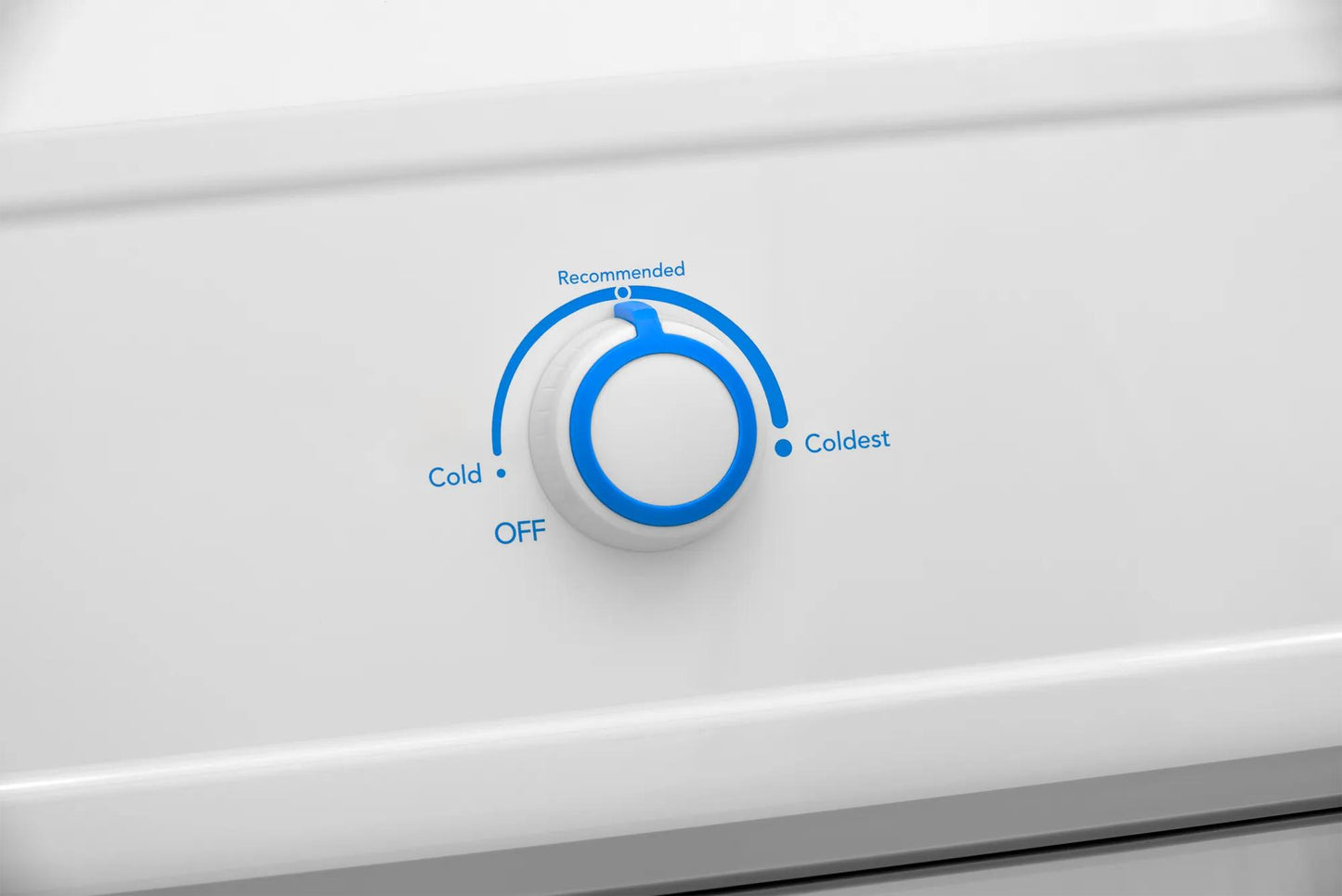 Close-up of white freezer temperature control dial showing settings from off to coldest in appliances collection