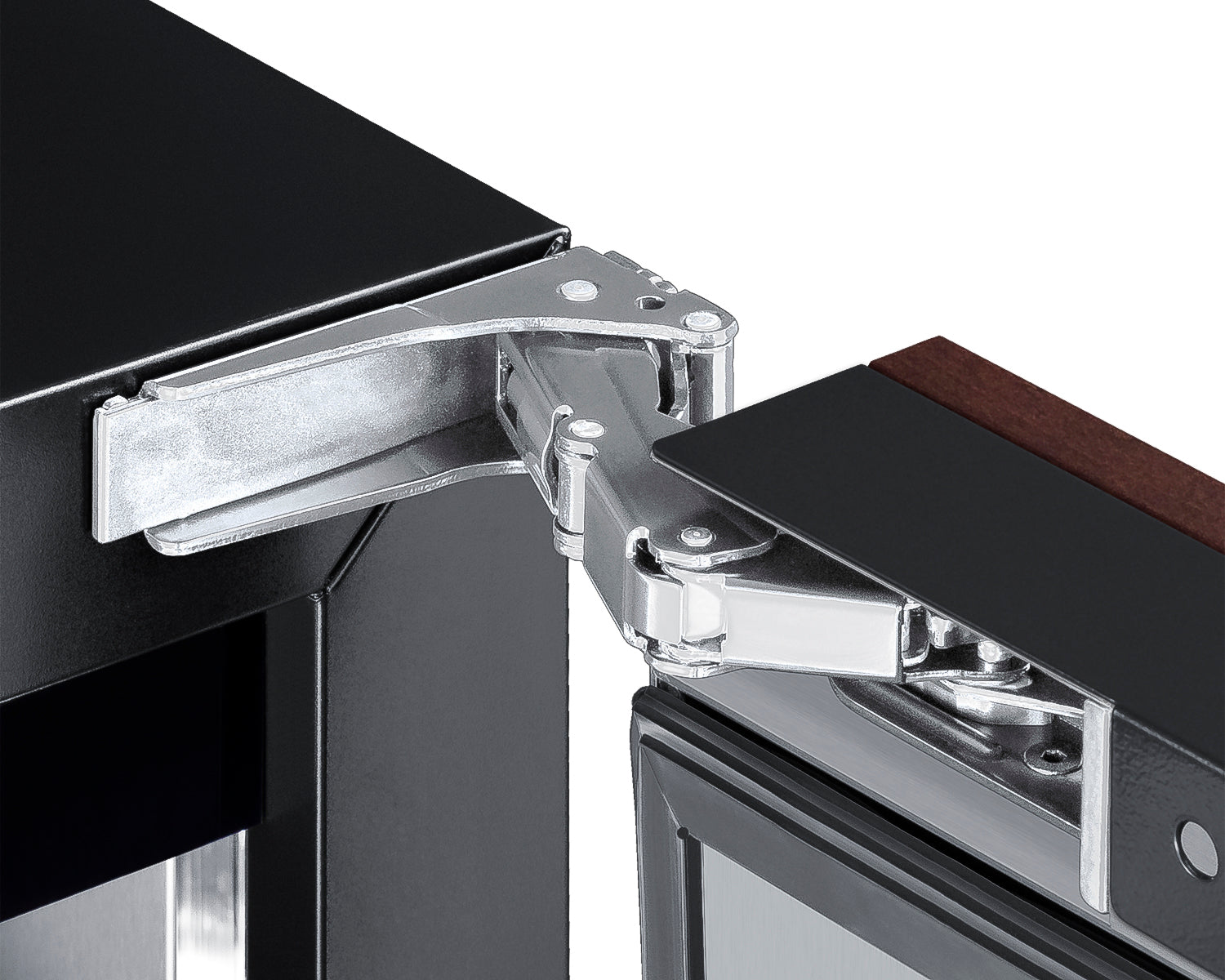 Close-up of silver hinge mechanism on built-in freezer door with black body and wood panel edge for kitchen installation