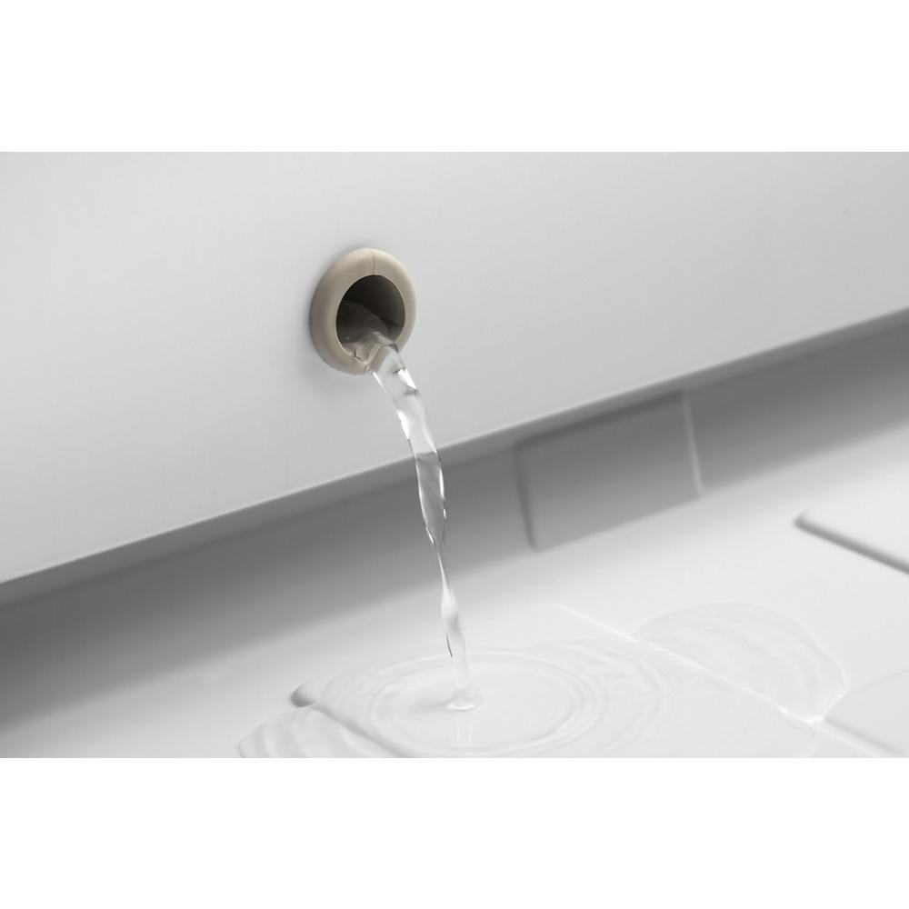 Close-up of water draining from the defrost drain hole inside a chest freezer from Freezers & Ice Makers collection