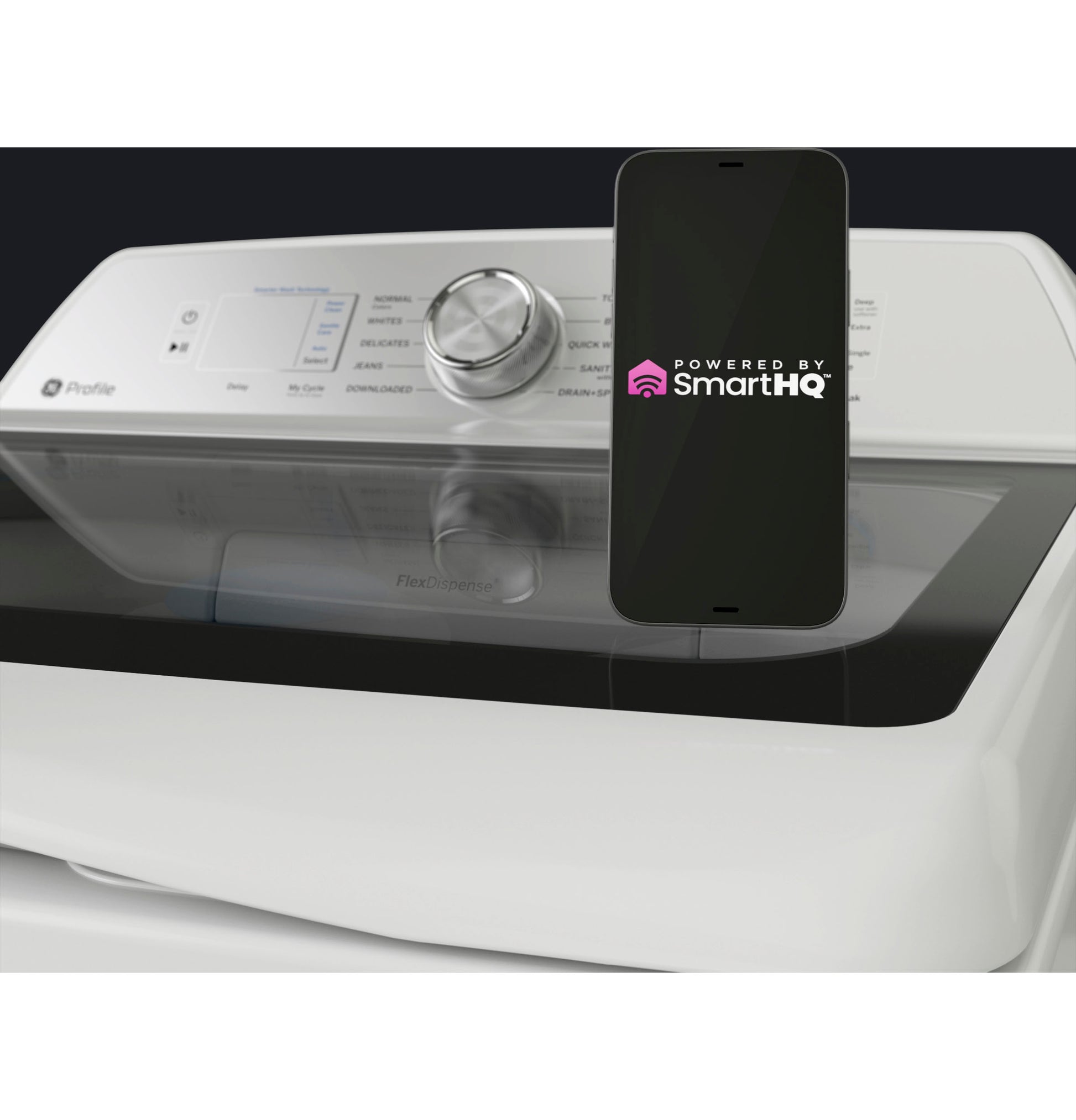 SmartHQ app displayed on smartphone resting on white top load washer control panel in home appliance setting