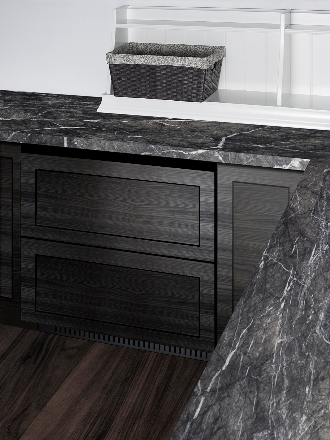 Built-in undercounter two-drawer refrigerator with dark wood finish and marble countertop in modern kitchen setting