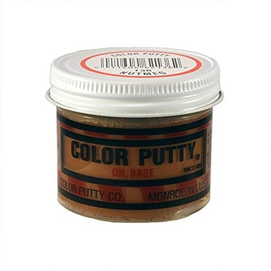 Small jar of nutmeg-toned oil-based color putty for wood repair in home improvement and patching supplies