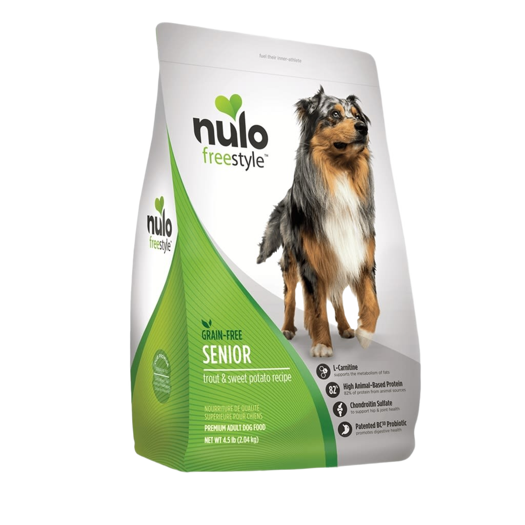 Green and white bag of grain-free senior dog food with a standing Australian shepherd on the label