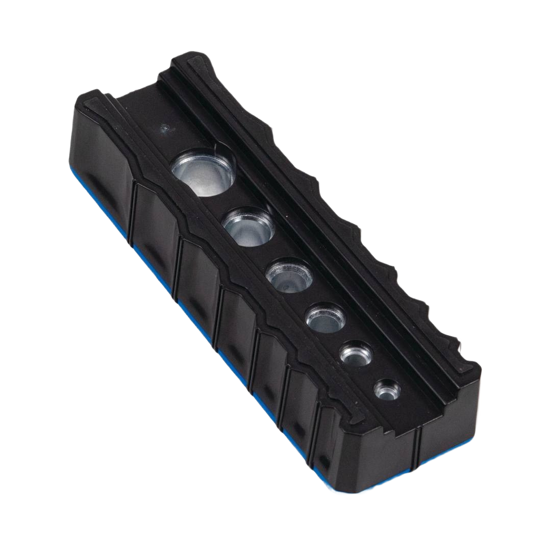 Black drilling guide block with six hardened steel bushings for precise hole alignment in tool accessories collections