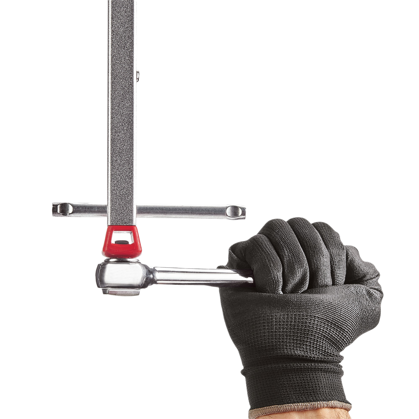 Gloved hand holding Milwaukee basin wrench with ergonomic telescoping handle for plumbing and home improvement tasks