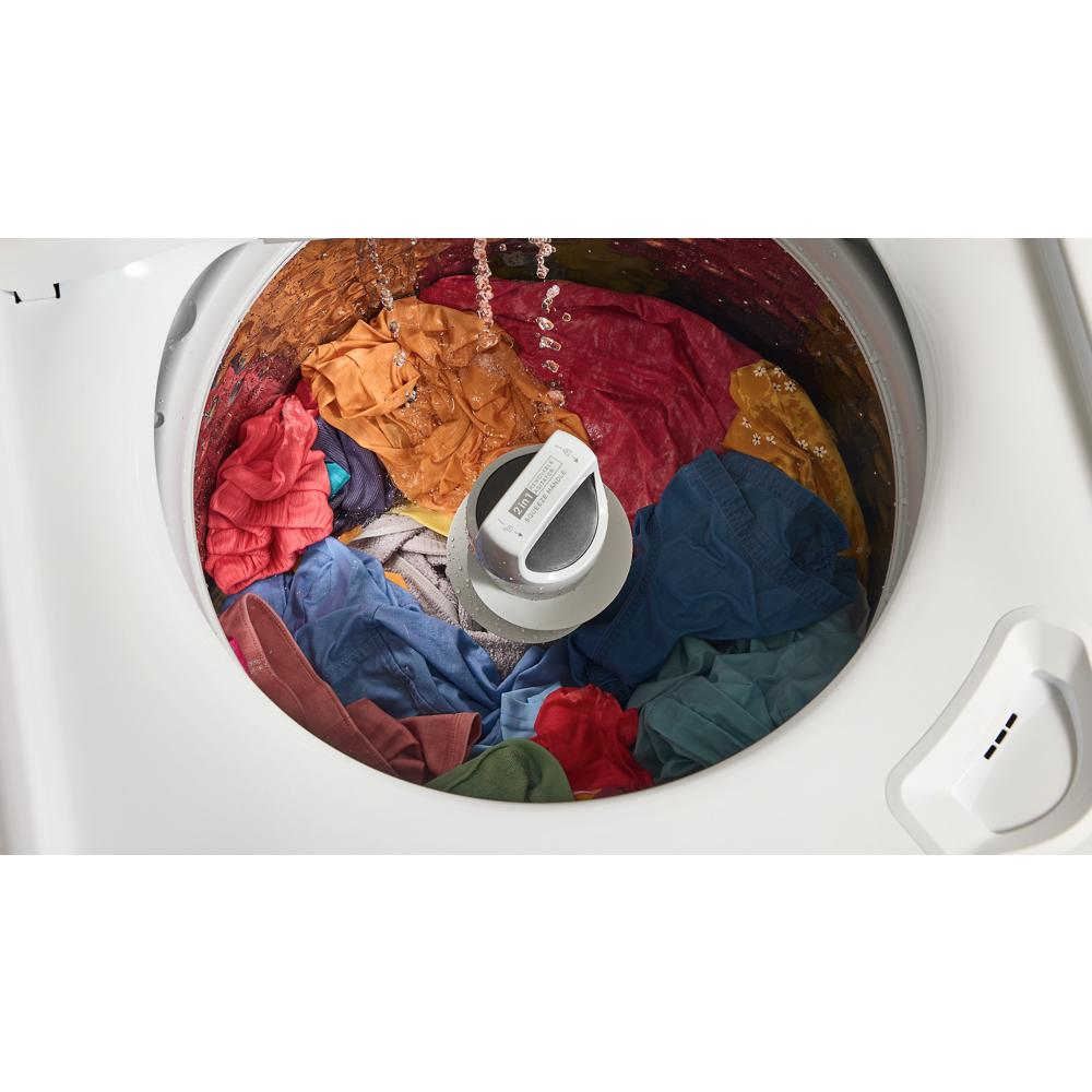 Top load washer mid-cycle with colorful clothes and water pouring inside in washers and appliances collection