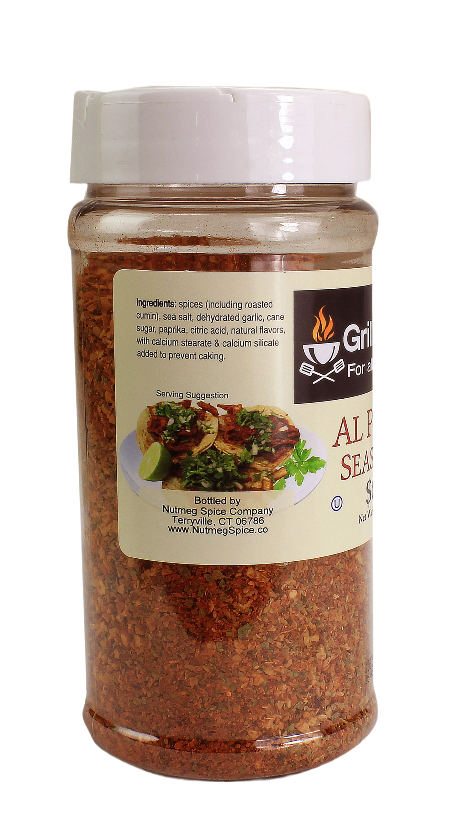 Clear plastic seasoning jar with white lid filled with reddish-brown al pastor spice blend for grilling and outdoor cooking collections