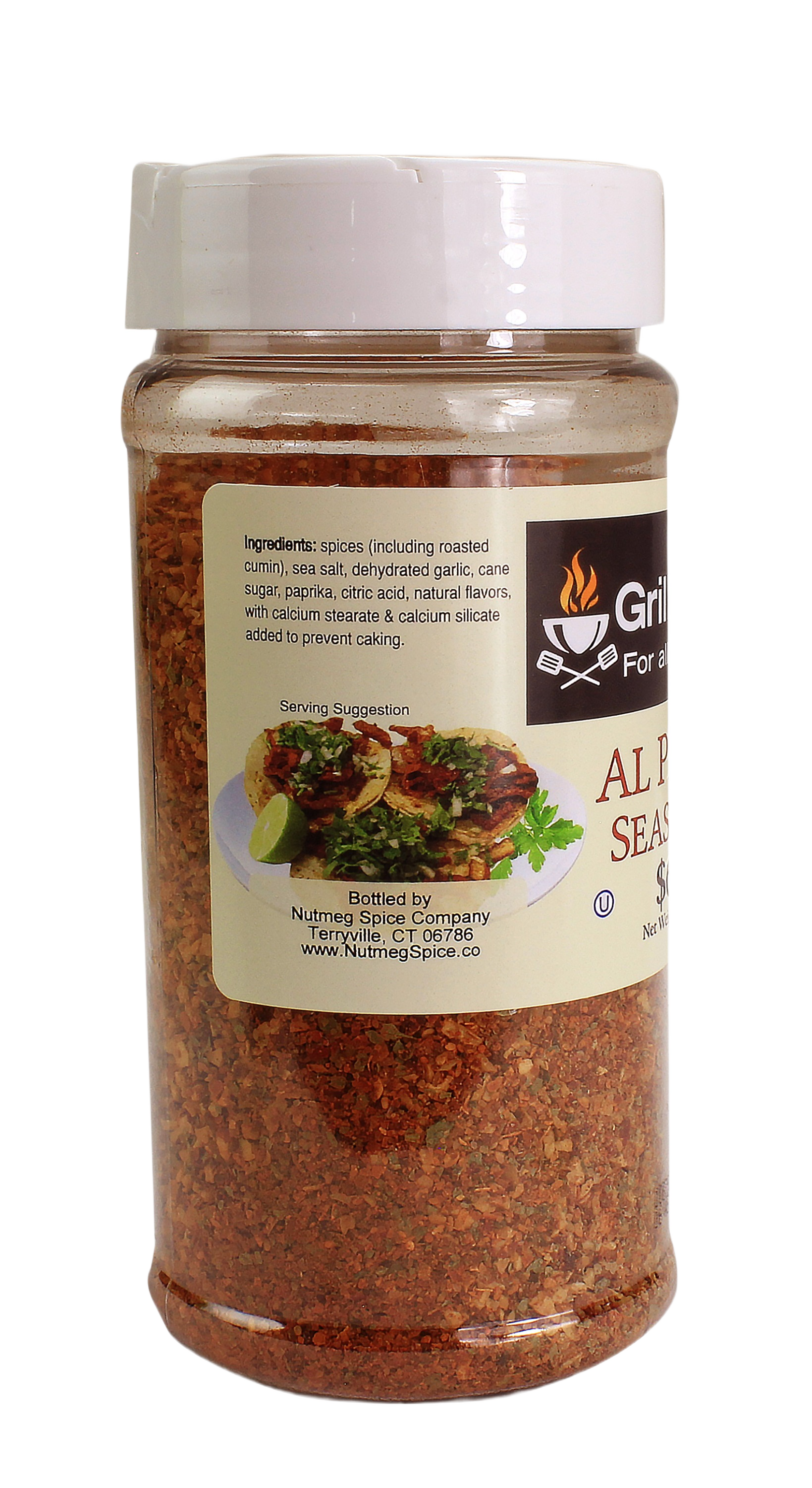 Clear plastic seasoning jar with white lid filled with reddish-brown al pastor spice blend for grilling and outdoor cooking collections