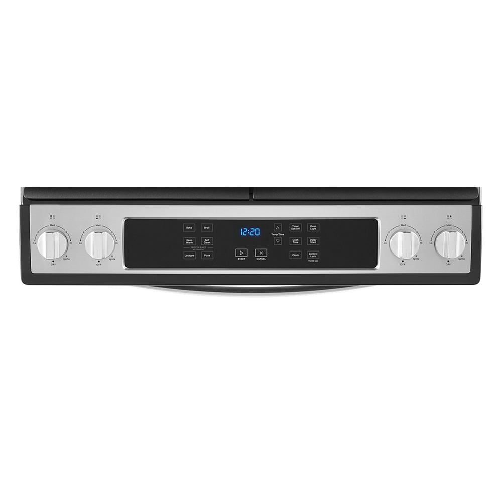 Control panel of stainless steel gas range with digital display and four burner control knobs from Ranges collection