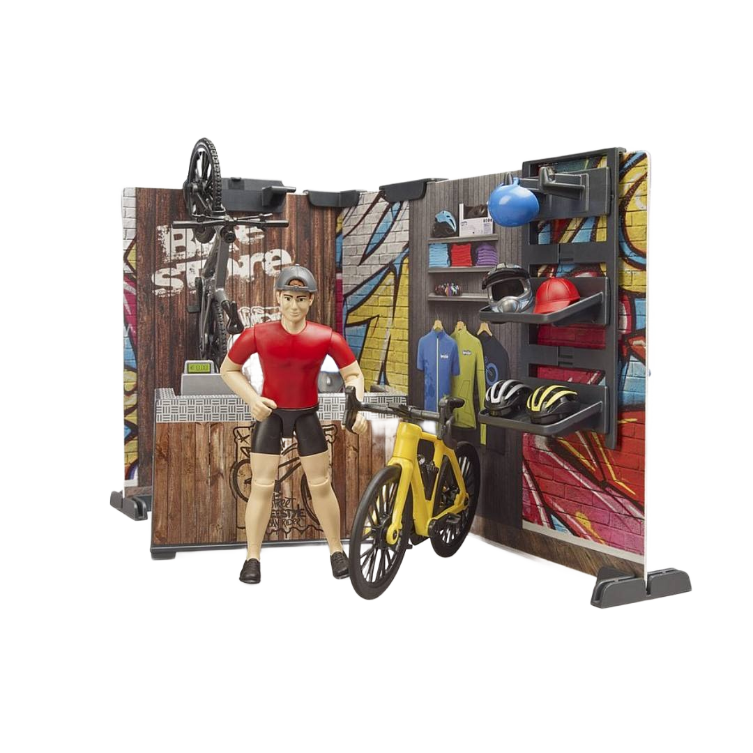 Toy bike shop playset with figure, yellow bike, helmets, and accessories in Bruder Toys and Toys & Games collections