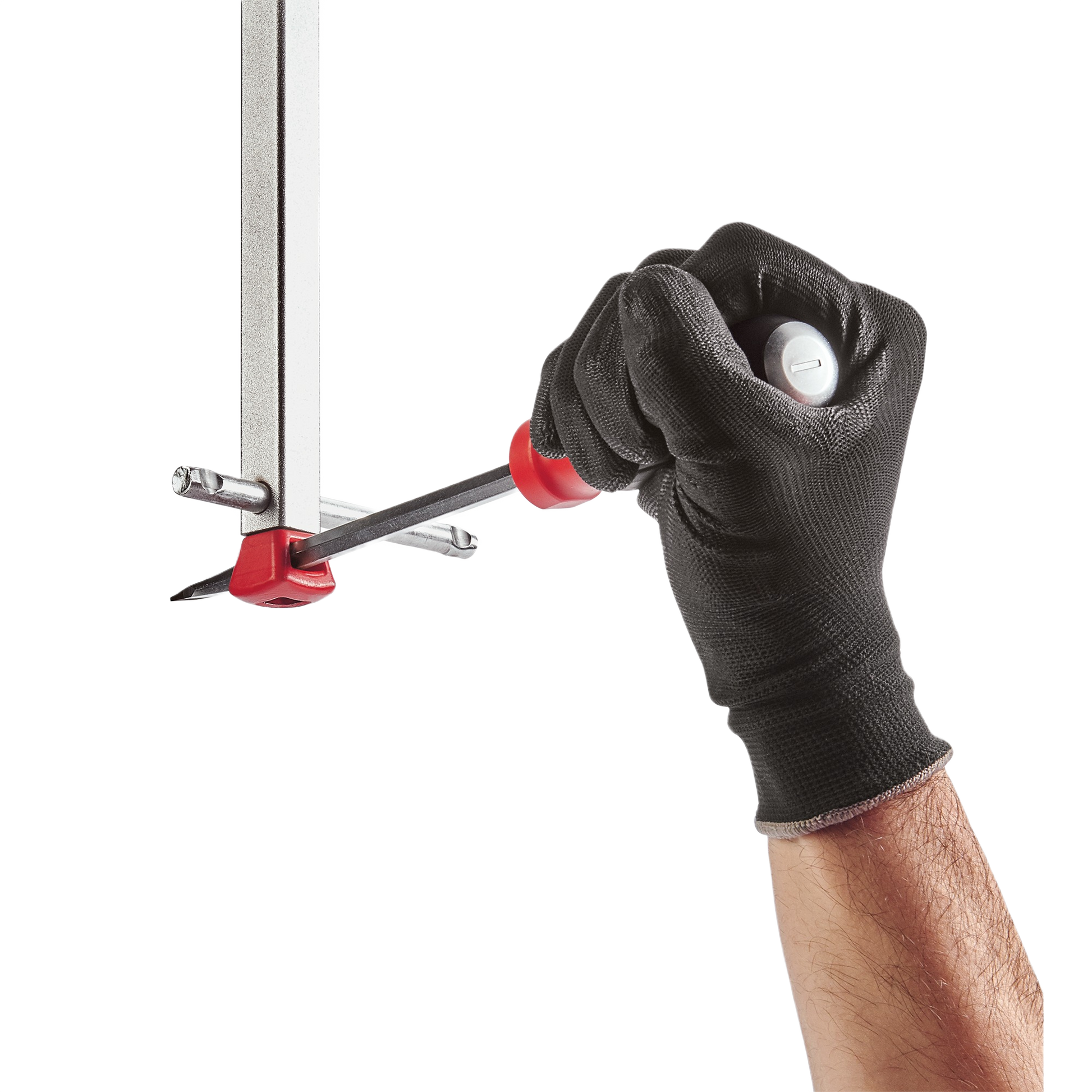 Hand wearing black glove gripping Milwaukee basin wrench with ergonomic handle for plumbing and home improvement tasks