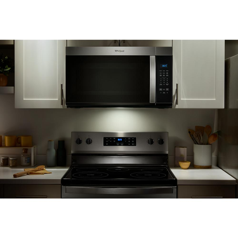 Stainless steel microwave from Over the Range Microwaves collection installed above matching electric stove in modern kitchen.