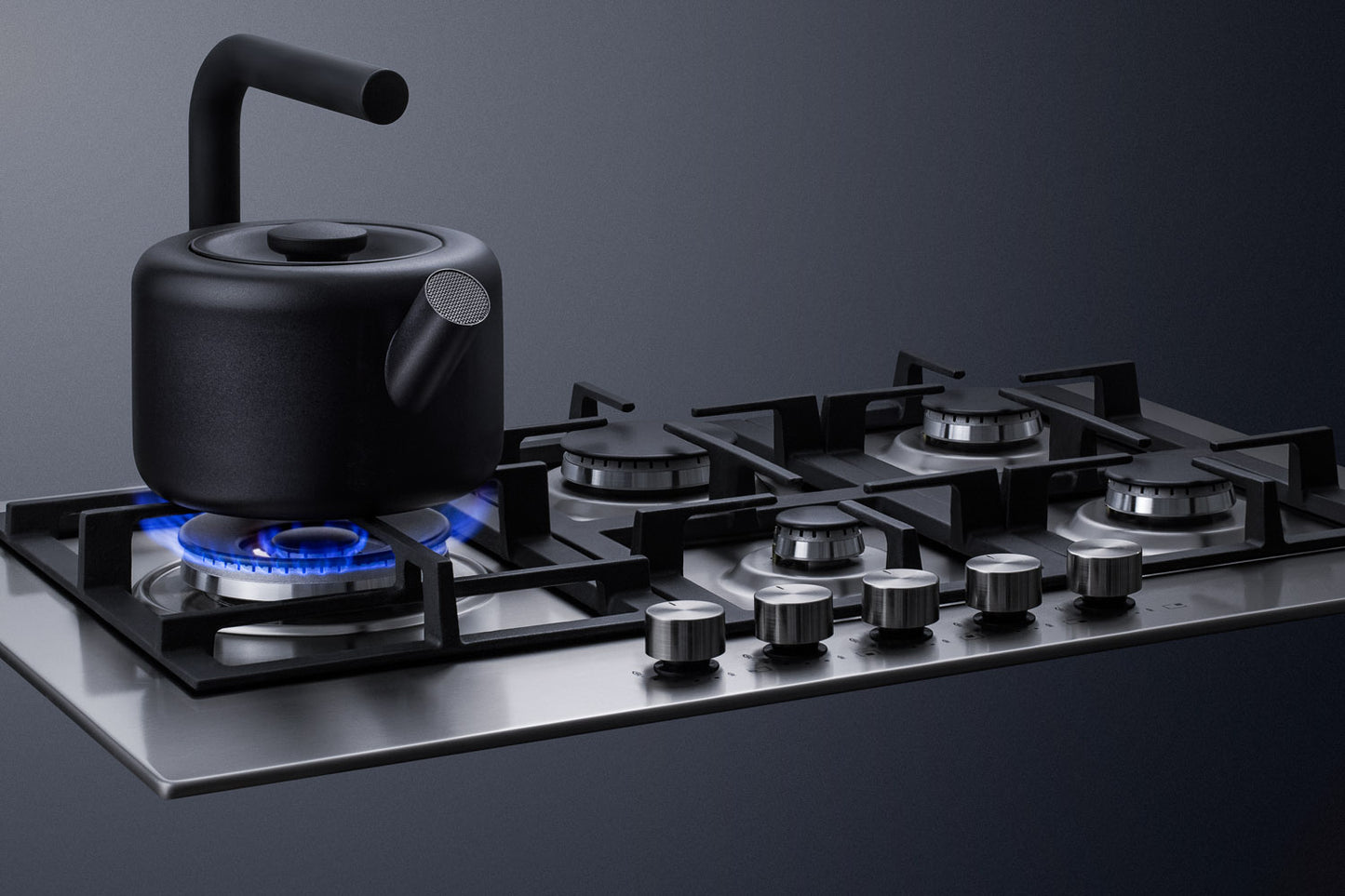 Modern stainless steel 30-inch cooktop with five burners and black cast iron grates in kitchenware collection