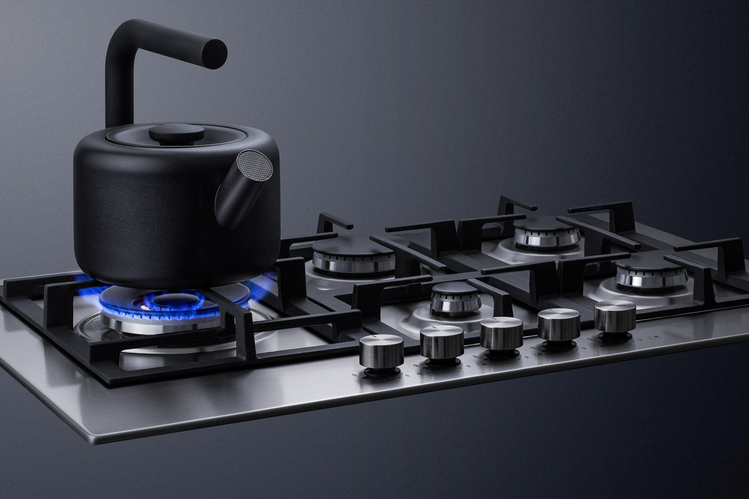 Modern stainless steel 30-inch cooktop with five burners and black cast iron grates in kitchenware collection