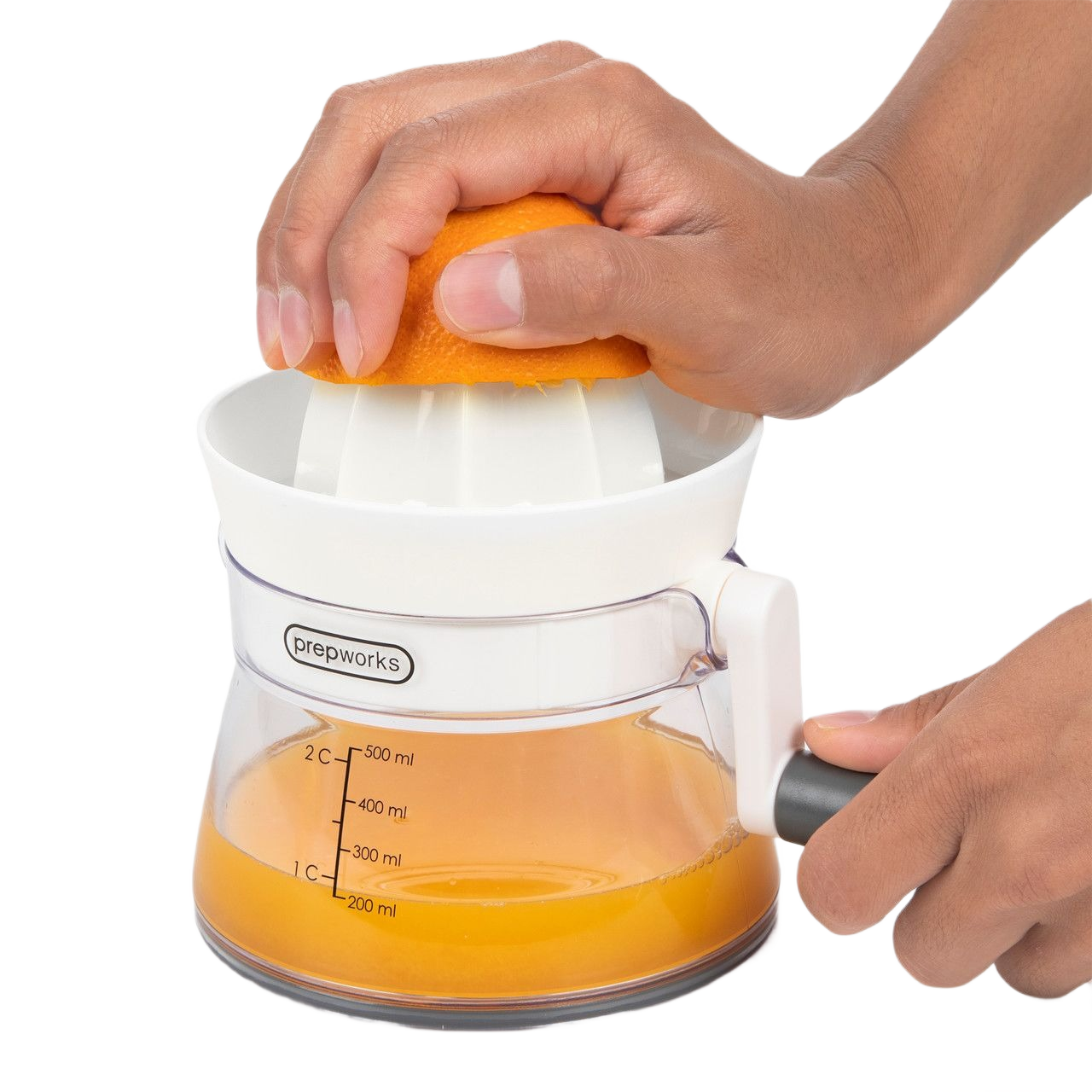 Clear and white manual citrus juicer with black handle and measurement marks for small kitchen appliances use