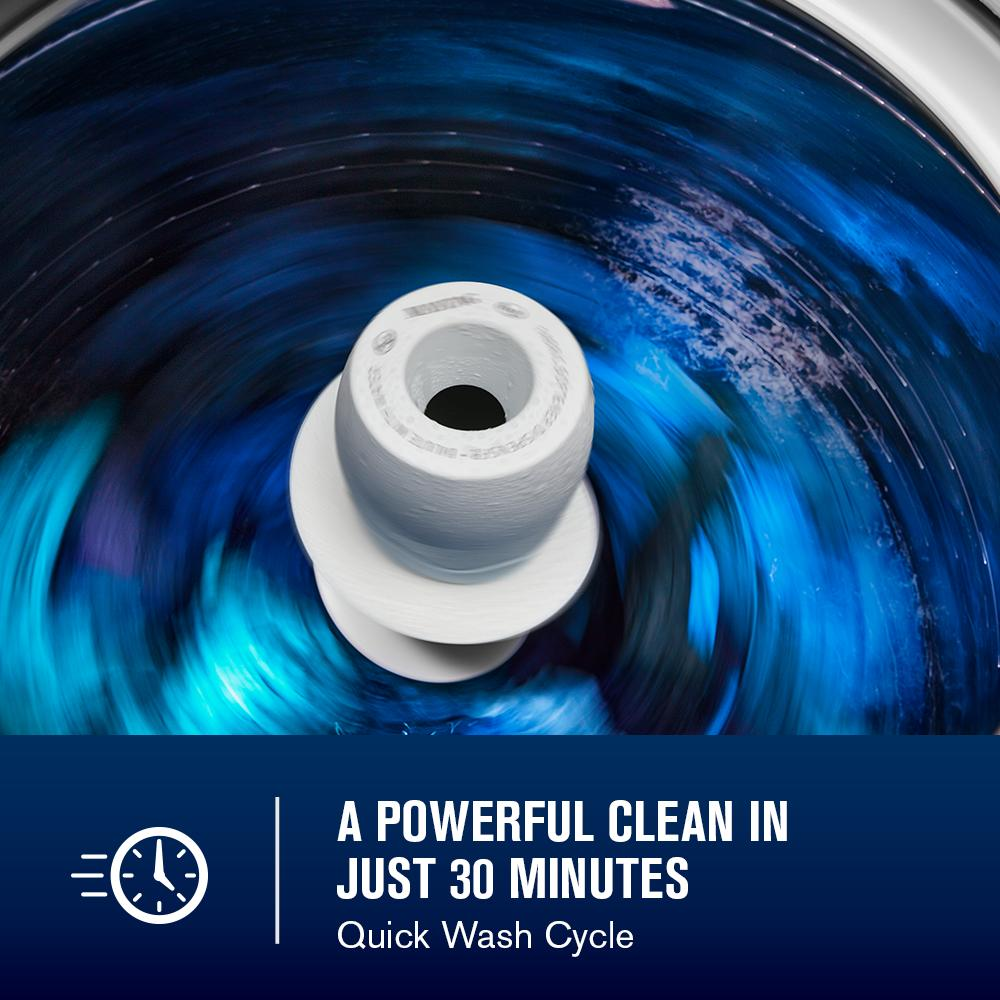 Inside view of white agitator spinning vibrant blue water during quick wash cycle in top load washer from appliances collection