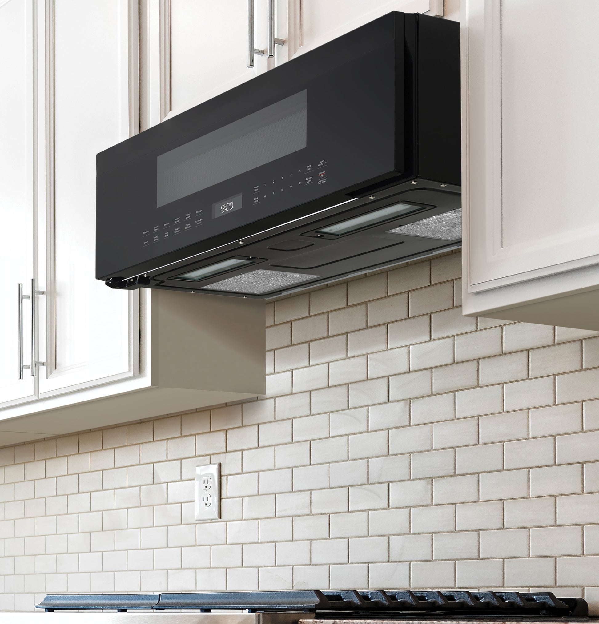 Black low-profile over-the-range microwave with sensor controls and under-cabinet lights in Kitchen & Appliances collections