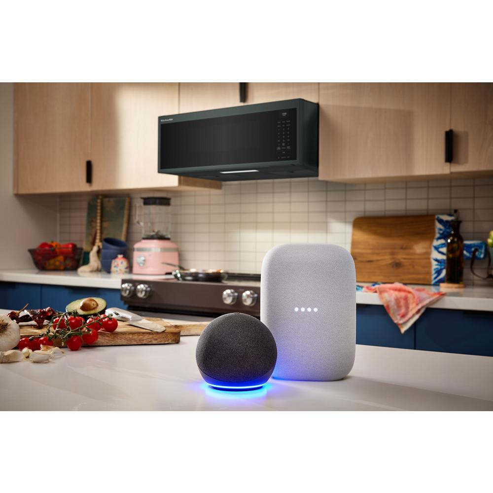 Black smart low profile microwave hood above stove with smart speakers on kitchen countertop for home improvement