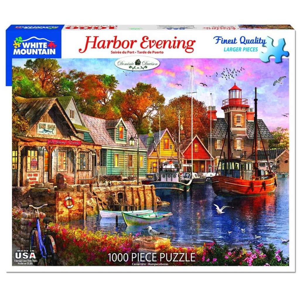 Colorful harbor scene at evening with boats, lighthouses, and quaint houses in a detailed 1000-piece puzzle illustration