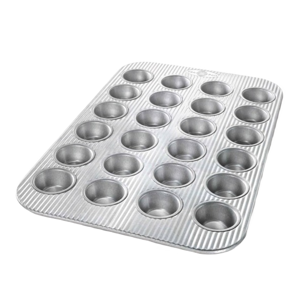 24-cup non-stick mini muffin pan crafted for easy baking in kitchenware and bakeware collections under $50
