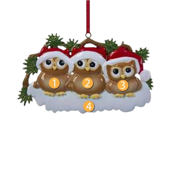Ornament featuring three brown owls wearing red Santa hats sitting on snow with pine greenery for Christmas décor.