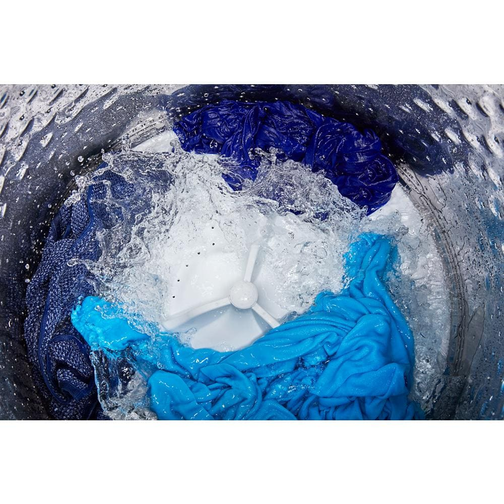 Interior view of top load washer with blue clothes swirling around Power™ Impeller in washers and appliances collection