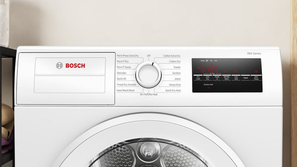 Control panel of a Bosch 300 Series compact condensation dryer with cycle selector dial and digital display in white finish