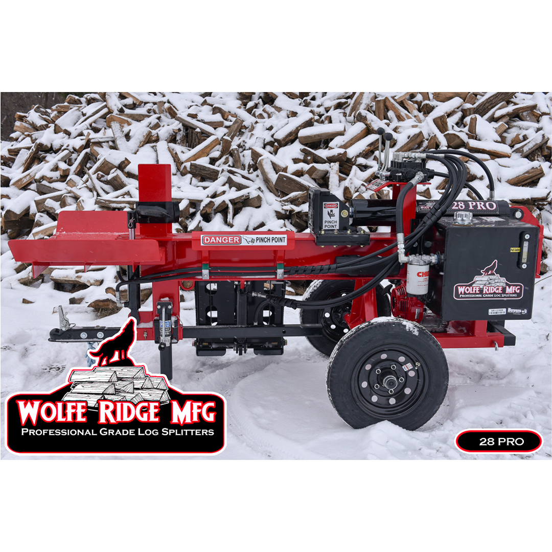 Red Wolfe Ridge 28-ton professional log splitter on snowy ground with large pile of firewood in background