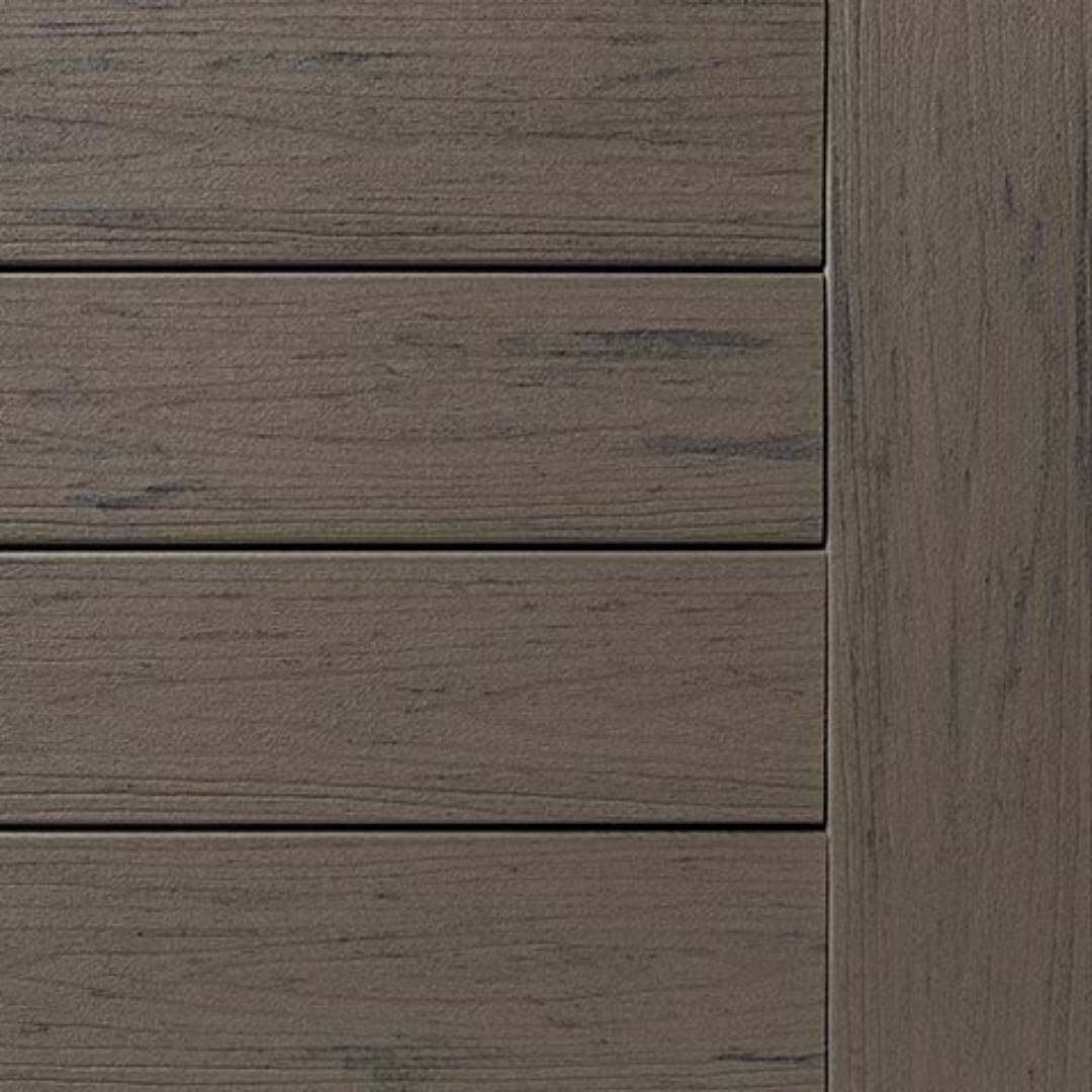 Close-up of grooved deck boards with textured silver maple wood grain pattern for outdoor decking projects
