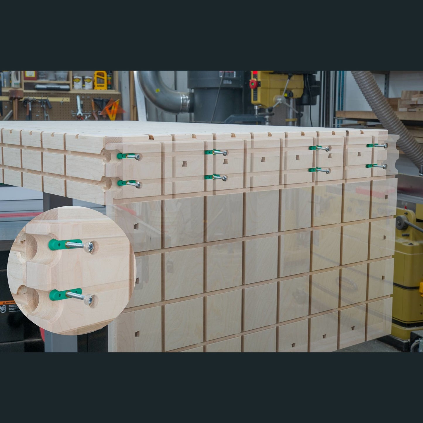 Wooden boards joined using green dovetail hardware clamps for woodworking and tool accessory projects in workshop setting