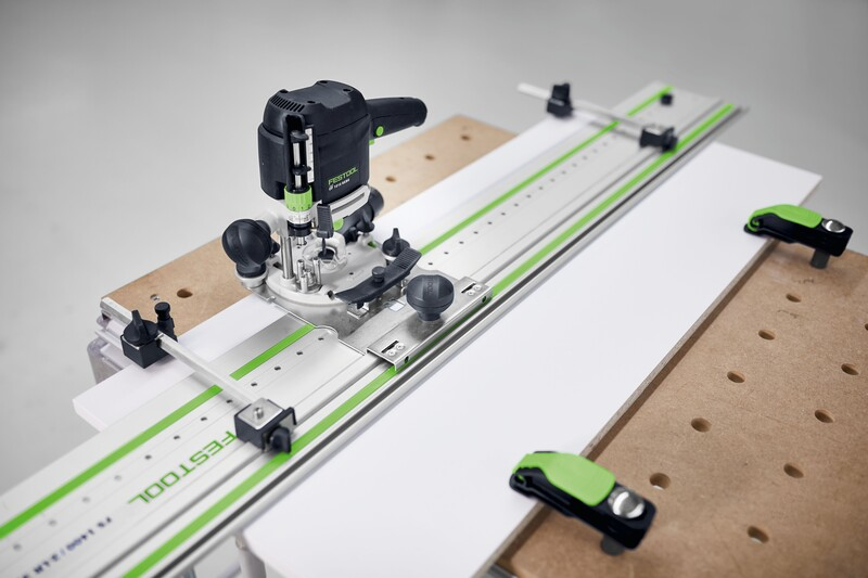 Festool router with guide stop and track system clamped to workbench for accurate woodworking cuts in home improvement tasks