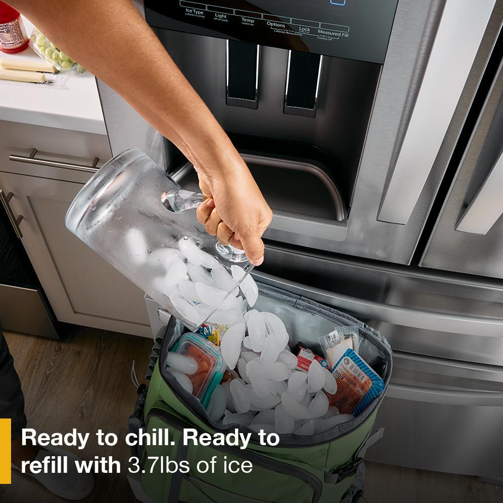 Hand pouring ice from a stainless steel French door refrigerator’s built-in dispenser into a cooler bag, part of Refrigerators, French Door Refrigerators, Kitchen & Kitchenware, and Appliances collections.