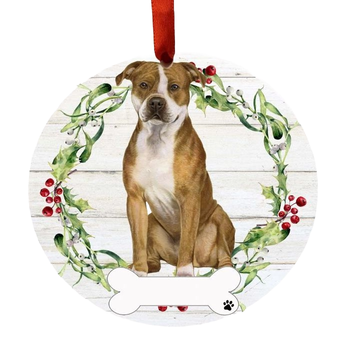 Round Christmas ornament featuring a brown and white Pit Bull dog surrounded by a festive green and red wreath