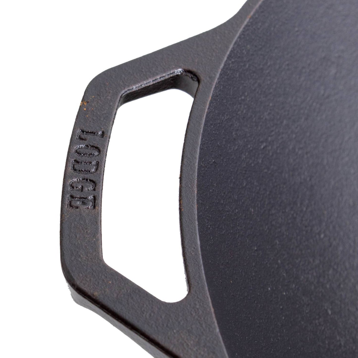 Close-up of a cast iron wok handle embossed with brand name for Kitchenware and Lodge Cast Iron collections under $100
