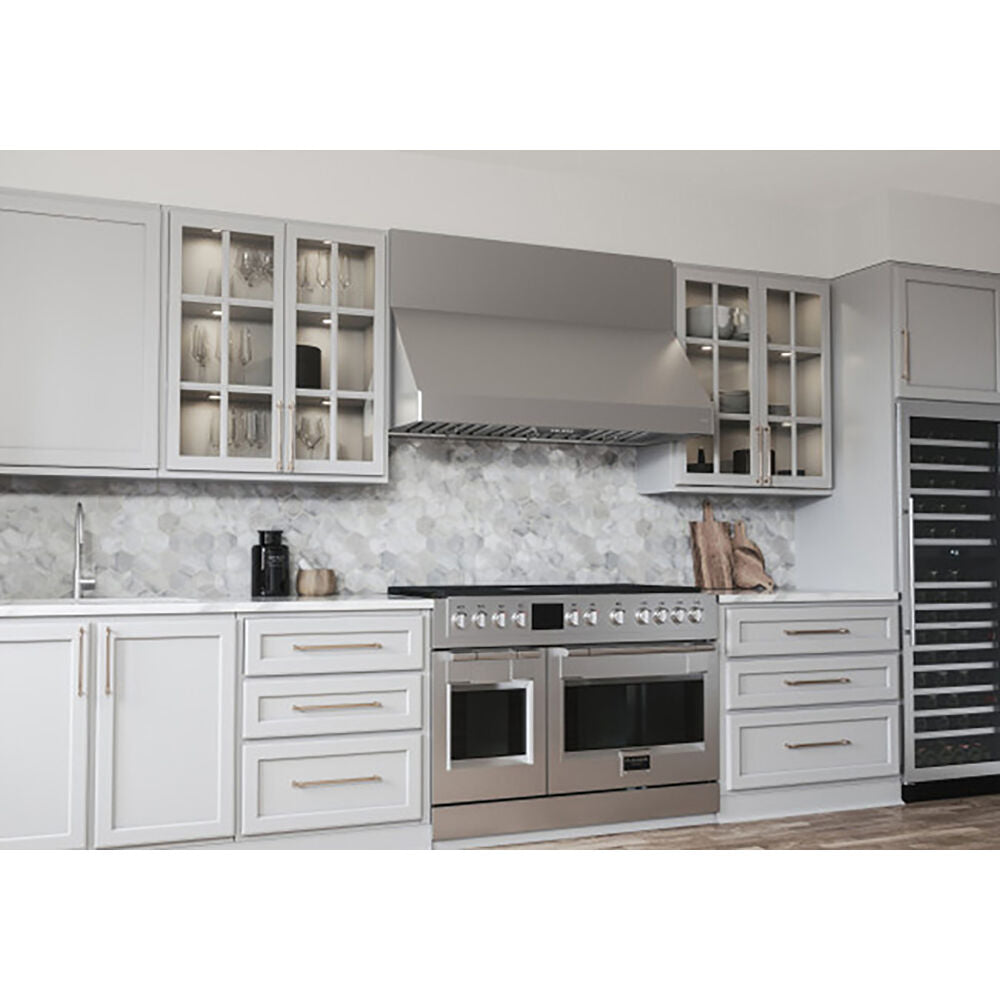 Stainless steel canopy hood installed above dual oven range with glass door cabinets in kitchen and range hoods collection